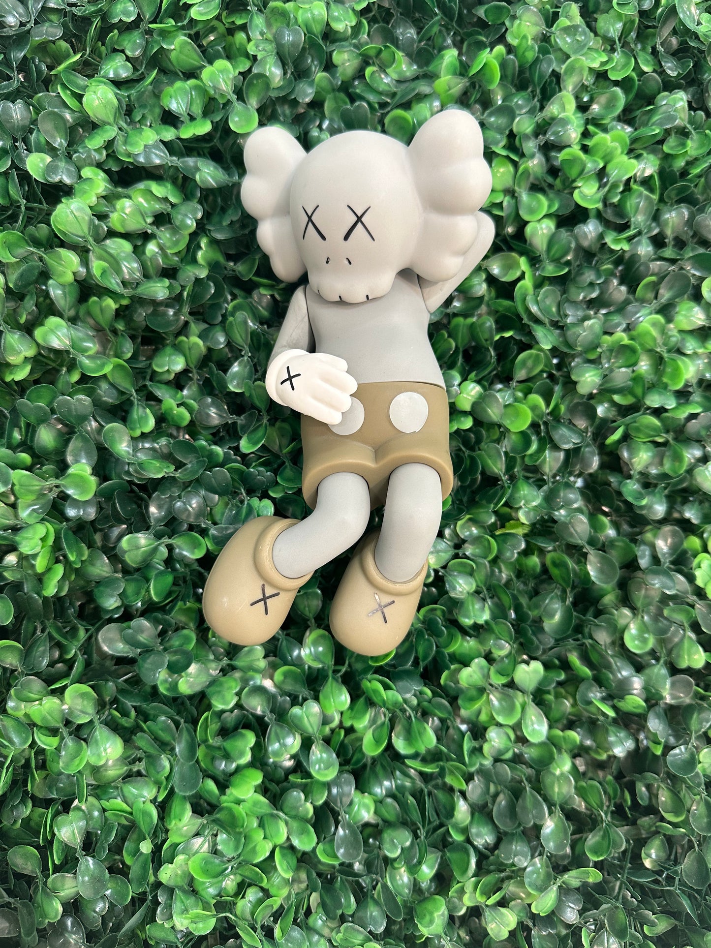 Kaws Grey Laying Down Figure