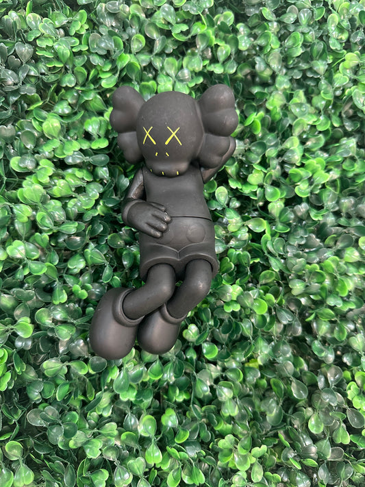 Kaws Black Laying Down Figure